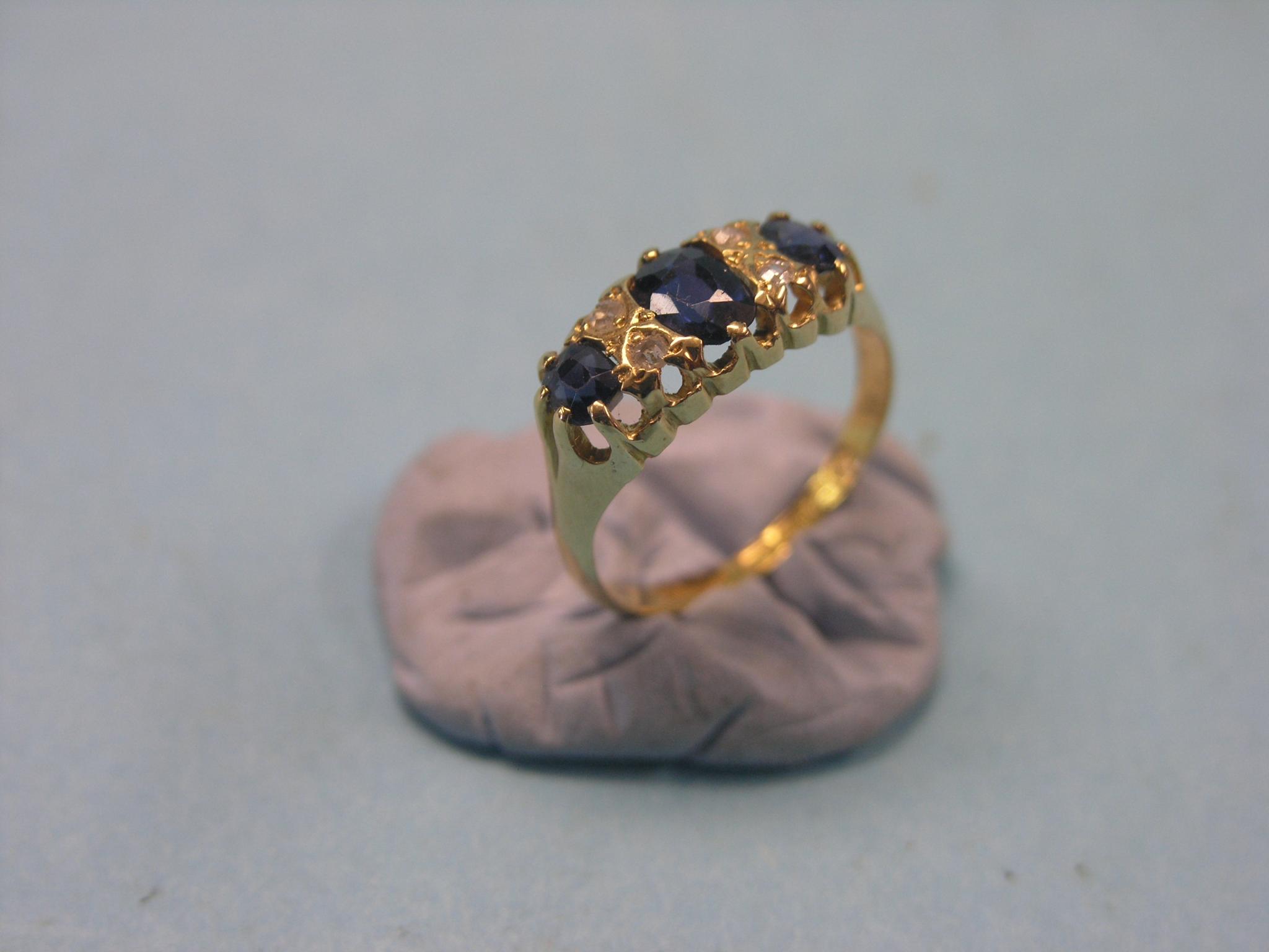 Appraisal: An ct gold engagement ring three sapphires and four diamond