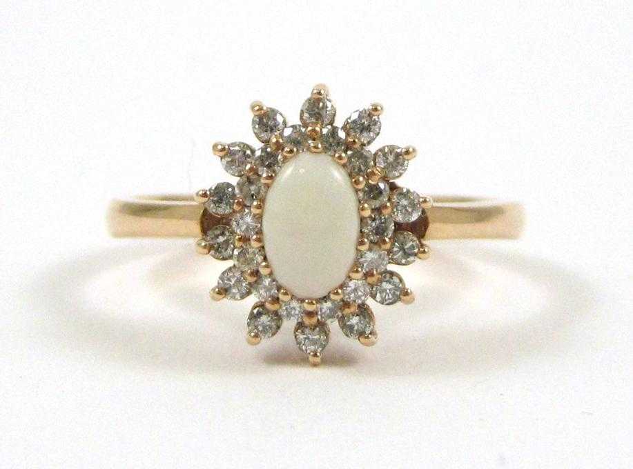 Appraisal: OPAL DIAMOND AND FOURTEEN KARAT GOLD RING The rose gold