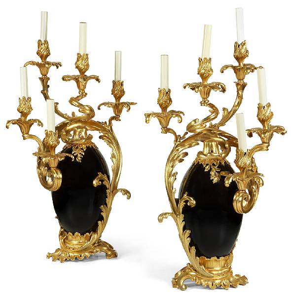 Appraisal: A pair of Louis XV style gilt bronze mounted patinated