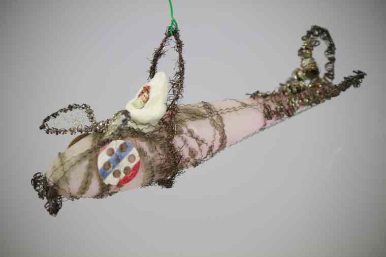 Appraisal: SANTA IN AIRPLANE GLASS ORNAMENT Blown glass wire wrap airplane