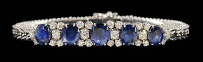 Appraisal: Sapphire and diamond bracelet set with five oval faceted blue