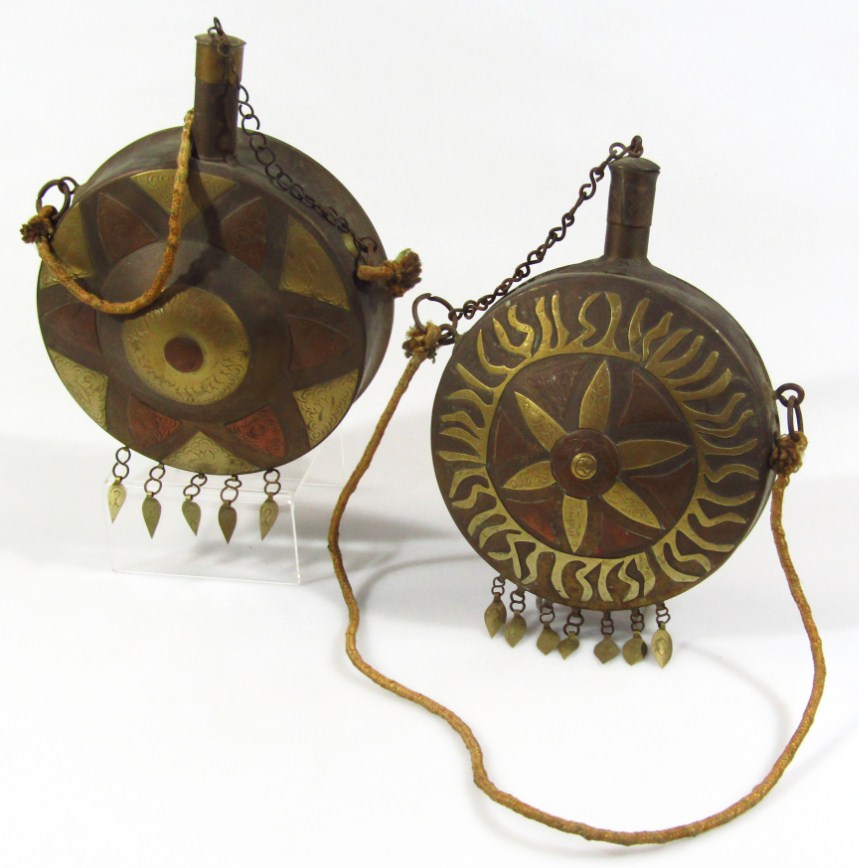 Appraisal: A Middle Eastern Arabic brass and copper powder flask of