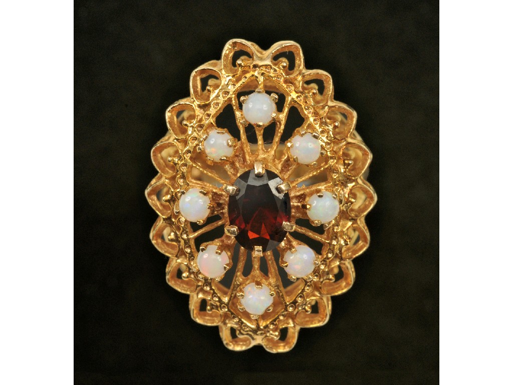 Appraisal: A Garnet and Opal Dress Ring claw-set central oval-cut garnet