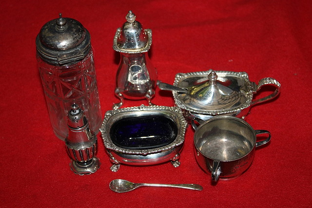 Appraisal: A SILVER THREE PIECE CONDIMENT SET with cabriole supports and