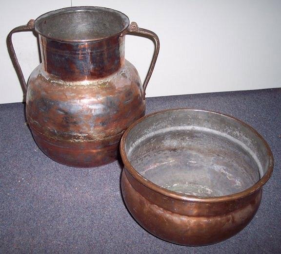 Appraisal: A copper two-handled vase and a circular copper dish