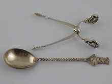 Appraisal: Georg Jensen A pair of sprung silver sugar nips magnolia