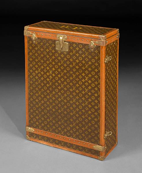 Appraisal: A Louis Vuitton trunk The rectangular hinged top centered by