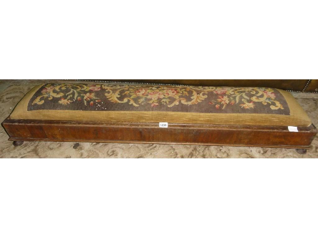 Appraisal: A Victorian walnut hearth foot stool of elongated rectangular form