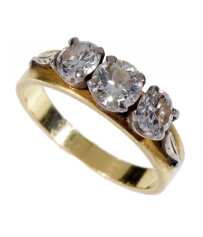 Appraisal: A DIAMOND THREE-STONE RING gold hoop