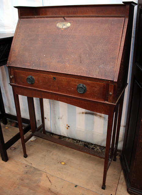 Appraisal: AN ART NOUVEAU WALNUT BUREAU with a galleried top the