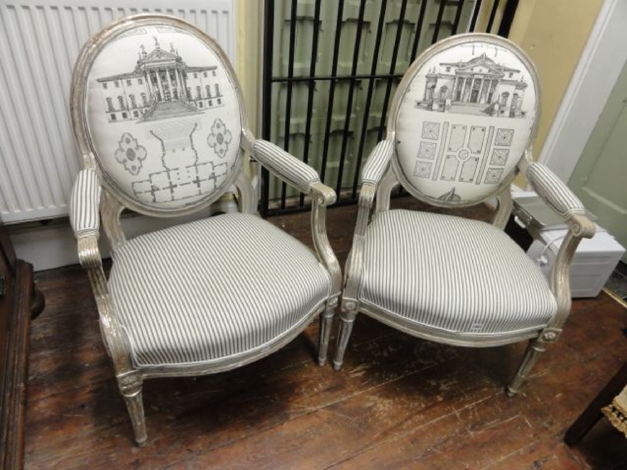 Appraisal: A pair of neo classical design open elbow chairs with