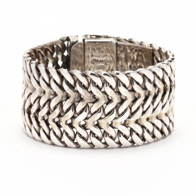 Appraisal: WIDE STERLING SILVER WOVEN BRACELET Designed in a woven motif