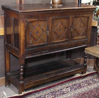 Appraisal: Continental carved cabinet Continental carved cabinet executed in quartersawn oak