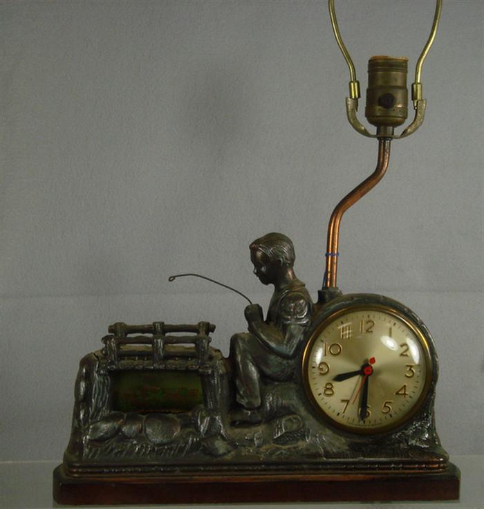 Appraisal: Sessions electric figural boy fishing clock table lamp l Estimate