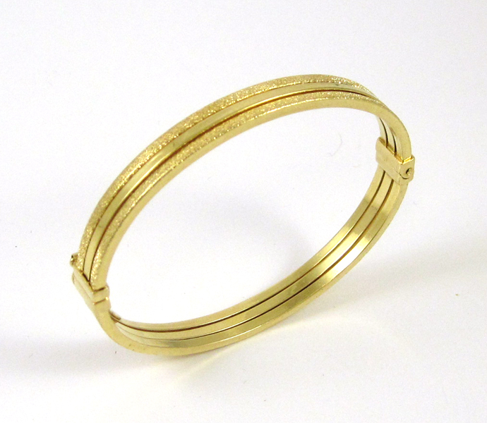 Appraisal: ITALIAN EIGHTEEN KARAT GOLD ARTLINEA BANGLE The yellow gold oval