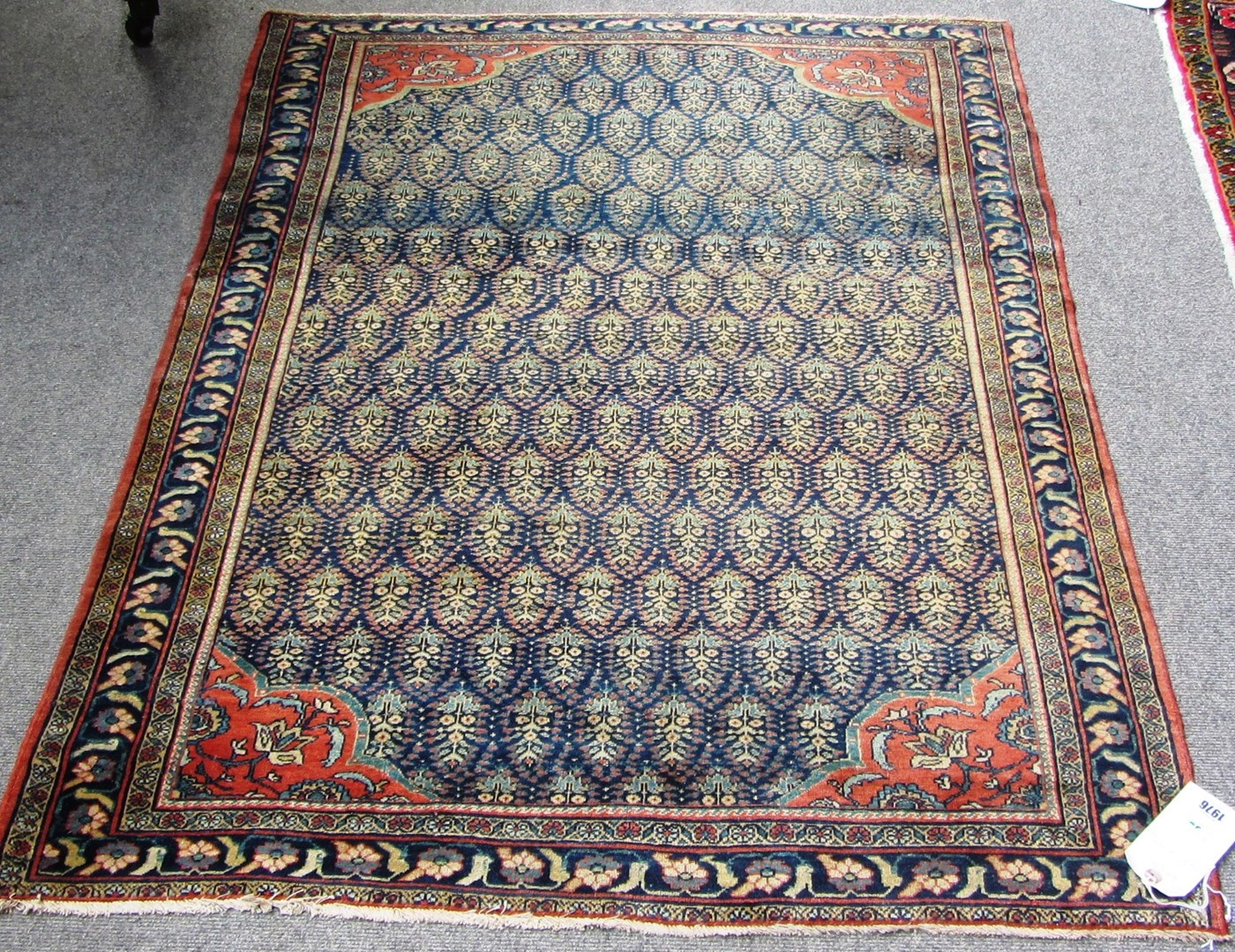 Appraisal: A Sarouk rug Persian the indigo field with interlocking floral