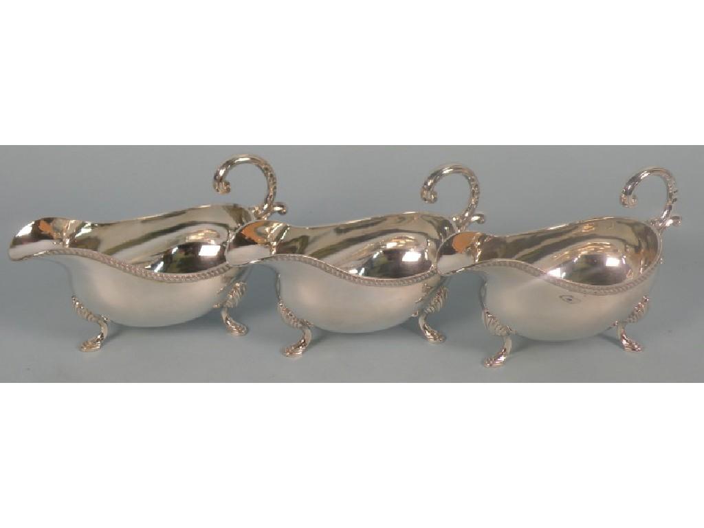 Appraisal: A set of three silver sauce boats in mid thC