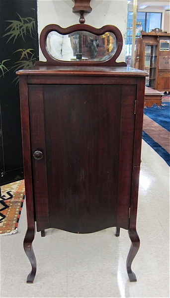 Appraisal: LATE VICTORIAN MAHOGANY MUSIC CABINET American c having a beveled