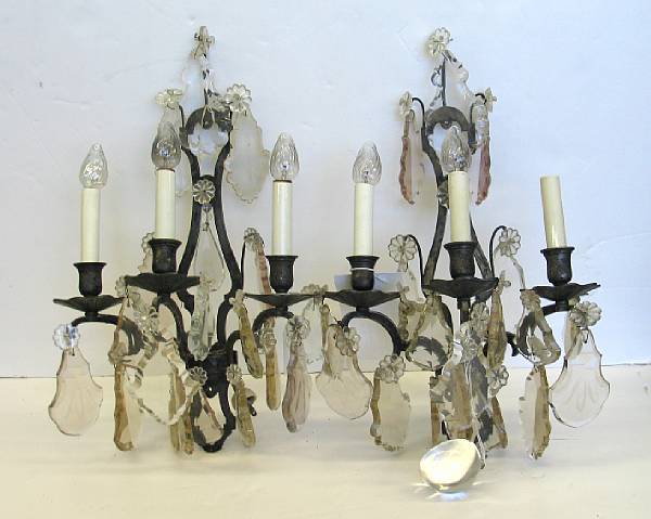 Appraisal: A pair of Neoclassical style metal and glass three light