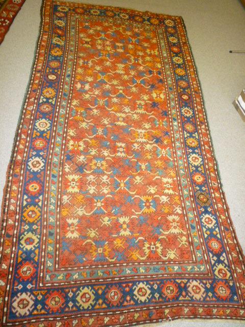 Appraisal: A CAUCASIAN RUG KAZAK early th century the muted red