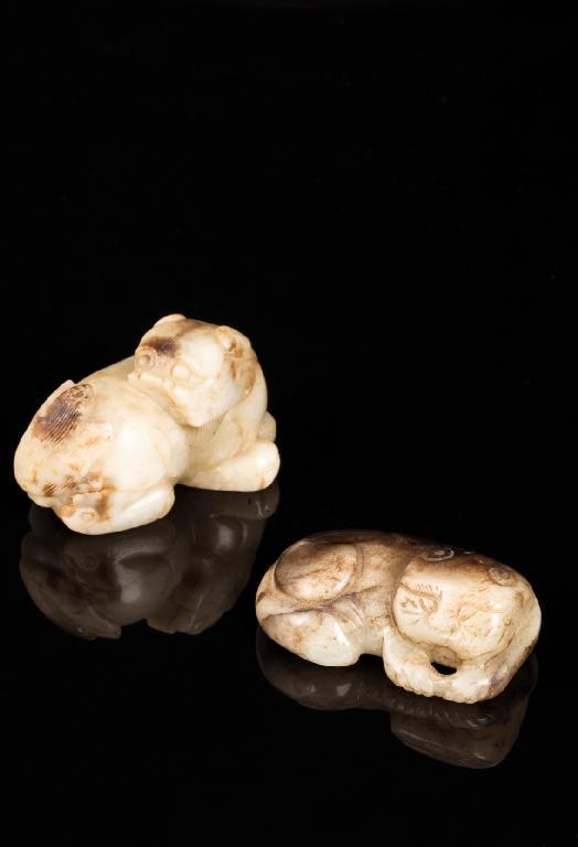 Appraisal: A CHINESE PALE CELADON JADE OF A BUDDHISTIC LION the