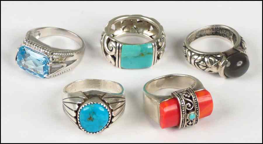 Appraisal: FIVE SILVER RINGS Two turquoise one coral one blue topaz