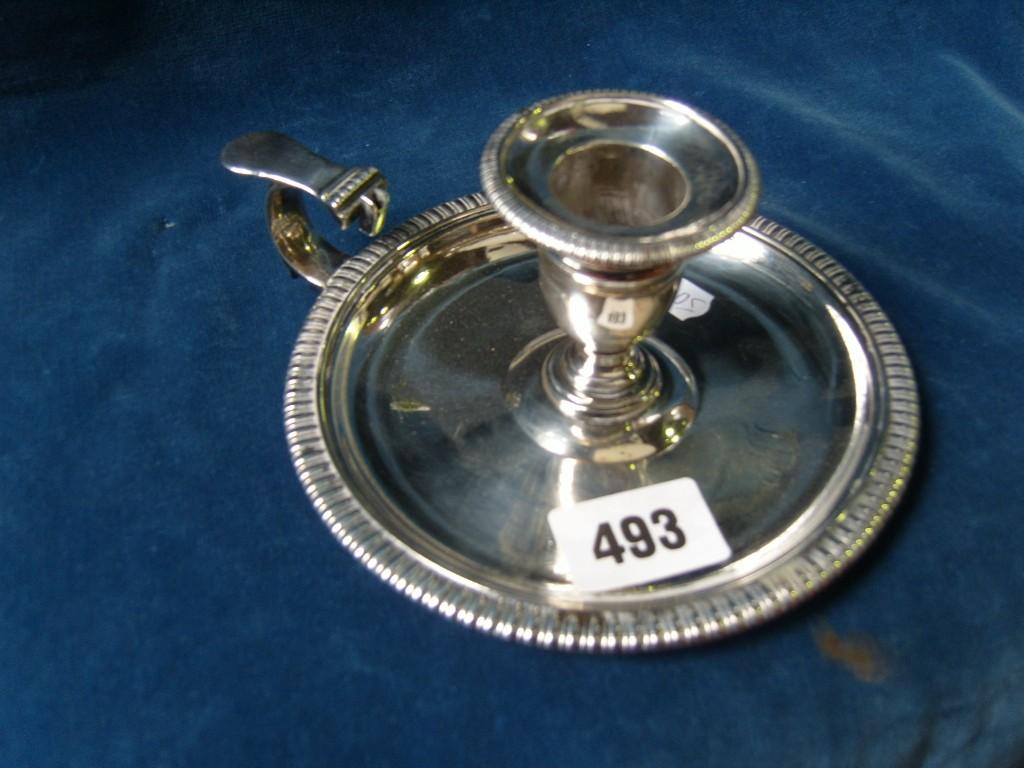 Appraisal: A Georgian silver chamberstick of circular form with gadroon border