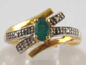 Appraisal: A yellow metal tests carat gold emerald and diamond ring