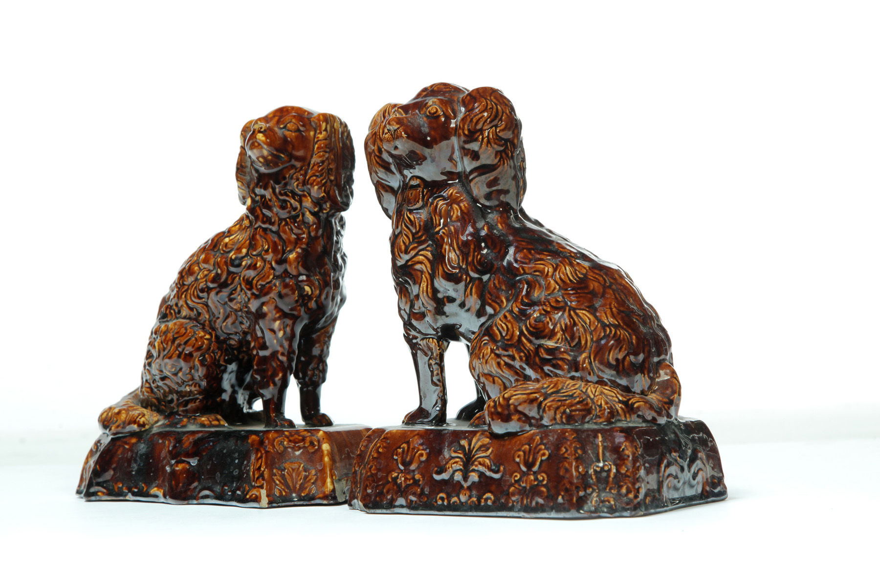 Appraisal: TWO SIMILAR ROCKINGHAM SPANIELS England rd quarter- th century Yellowware