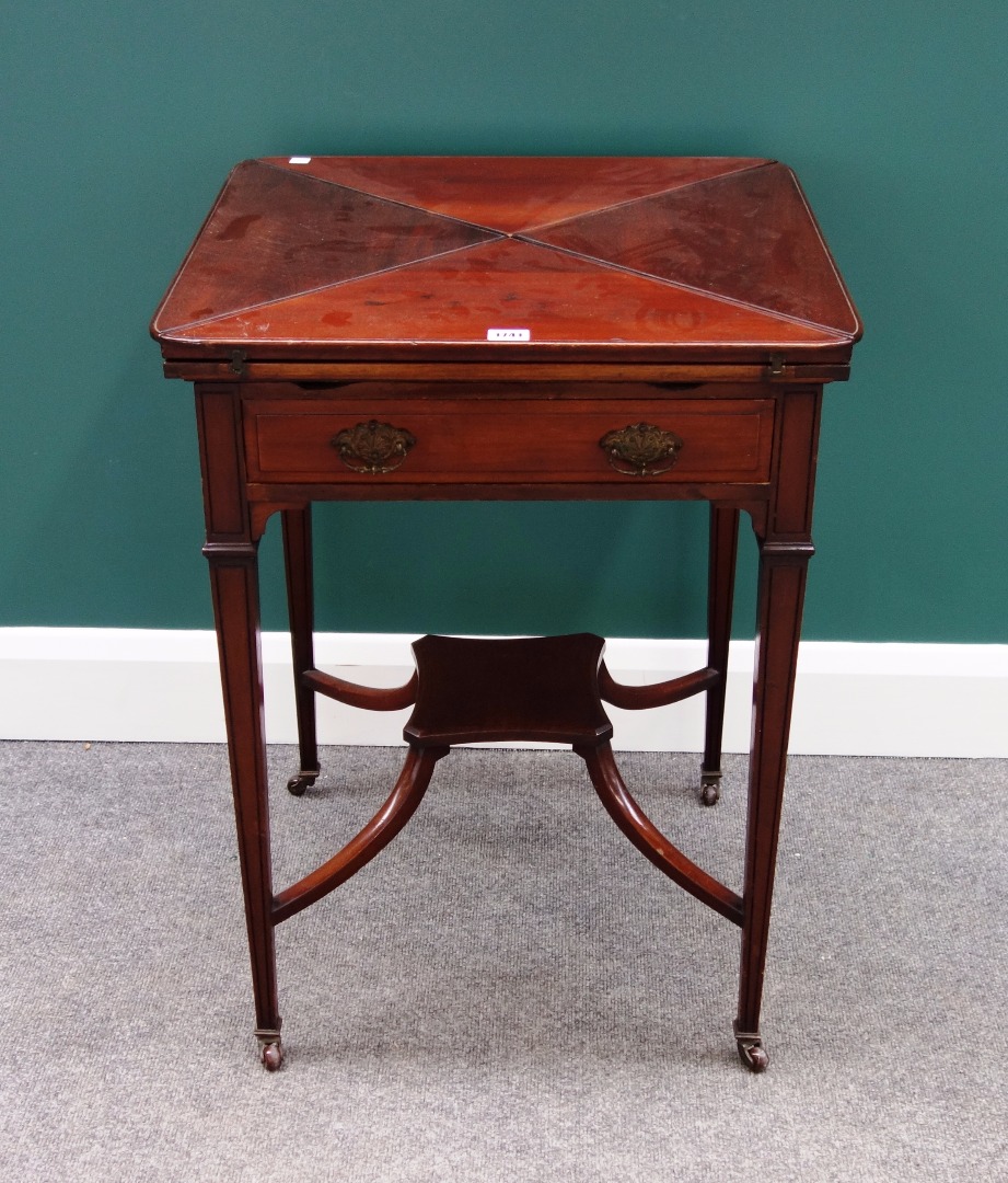 Appraisal: A late Victorian mahogany envelope card table the single frieze