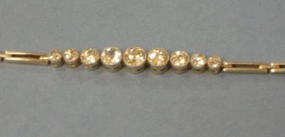 Appraisal: A DIAMOND BRACELET comprising nine old brilliant cut diamonds in