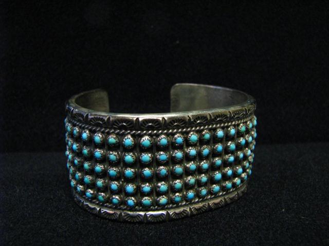 Appraisal: Silver Native American cuff bracelet with turquoise geometric ''row'' design