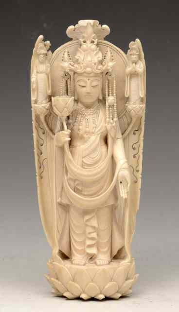 Appraisal: A CHINESE CARVED IVORY MODEL OF KWANNON Goddess of Mercy