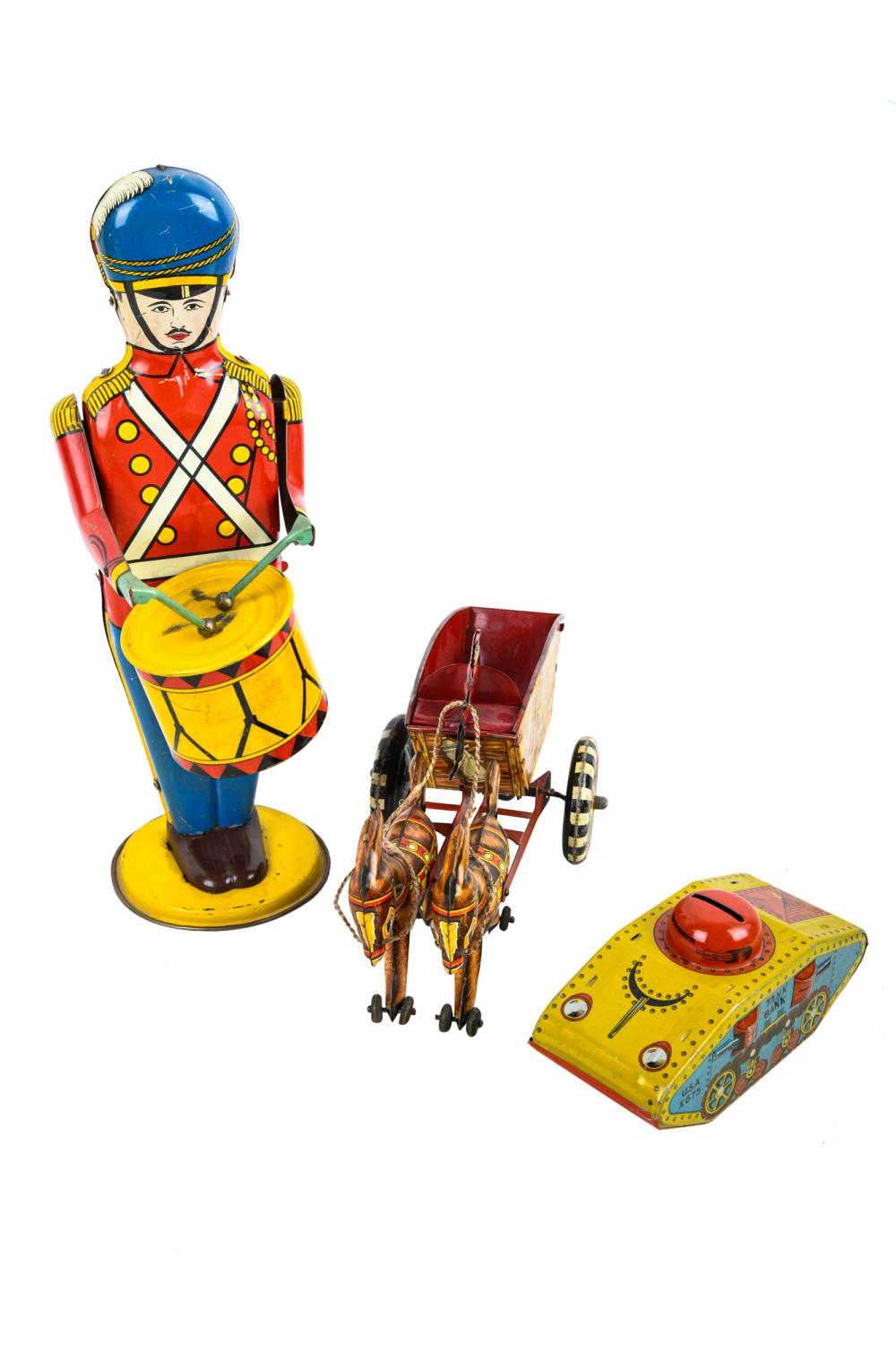 Appraisal: THREE TIN TOYSincluding a wind up Wolverine No drum major