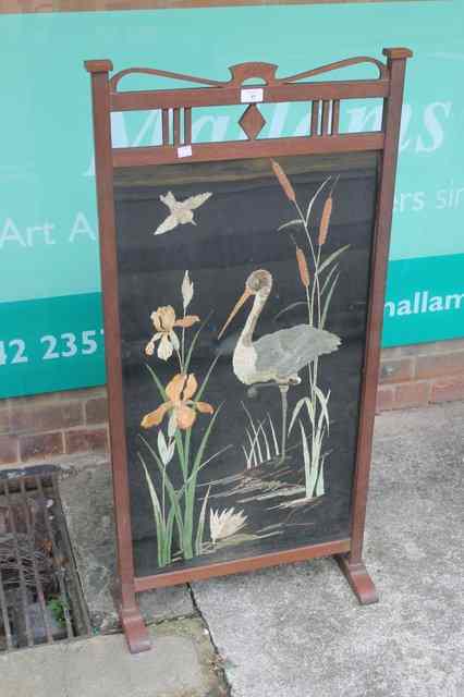 Appraisal: AN ART NOUVEAU STYLE OAK FIRE SCREEN of shaped decoration