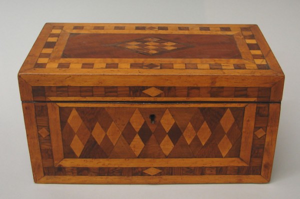 Appraisal: Tea caddy features wood inlay on three sides and lid