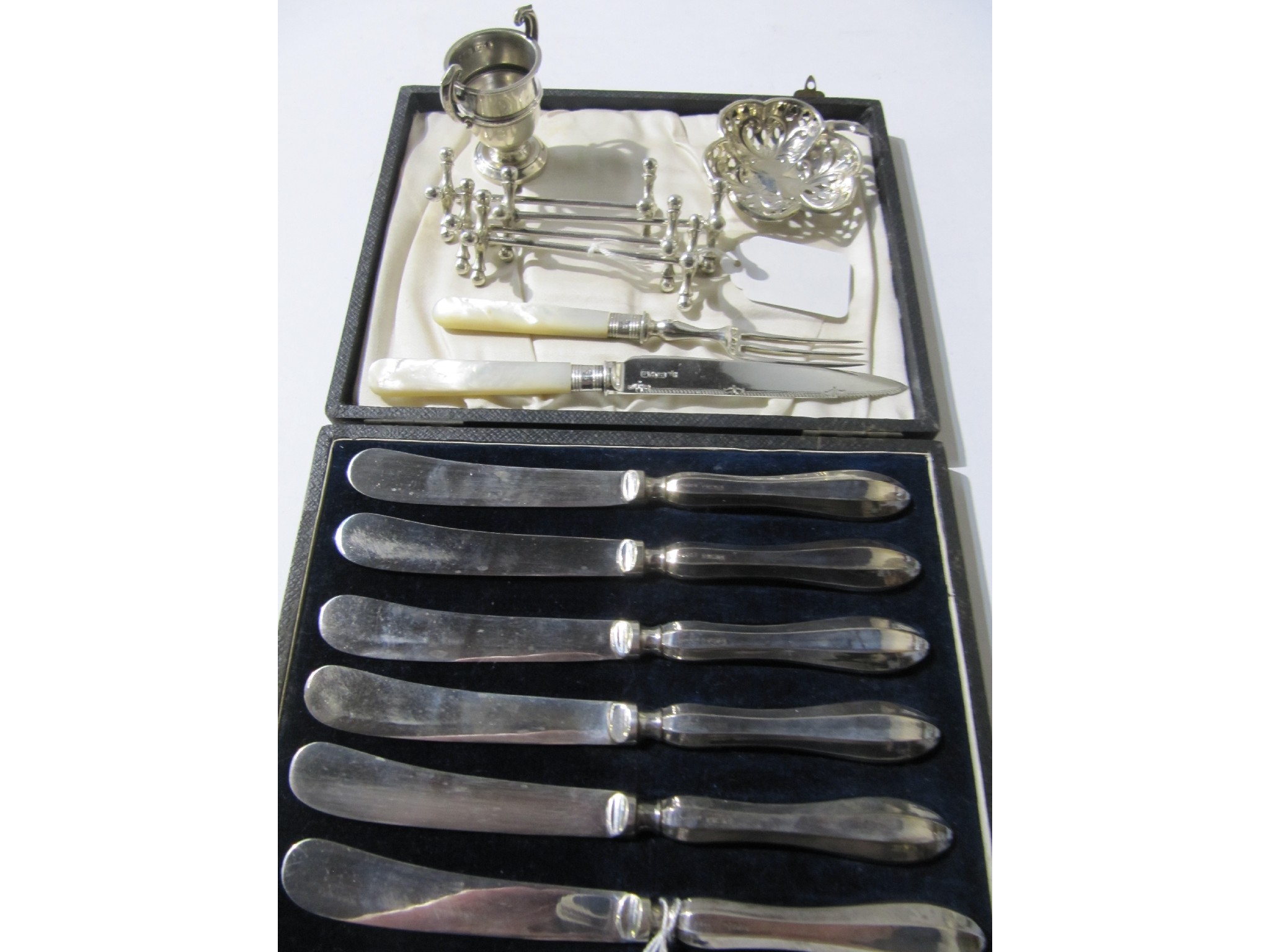 Appraisal: A lot comprising a cased set of six silver handled