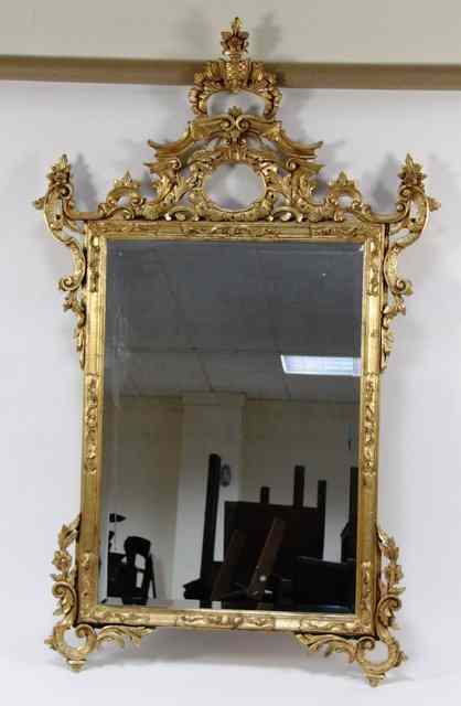 Appraisal: A carved gilt wood wall mirror of George II style