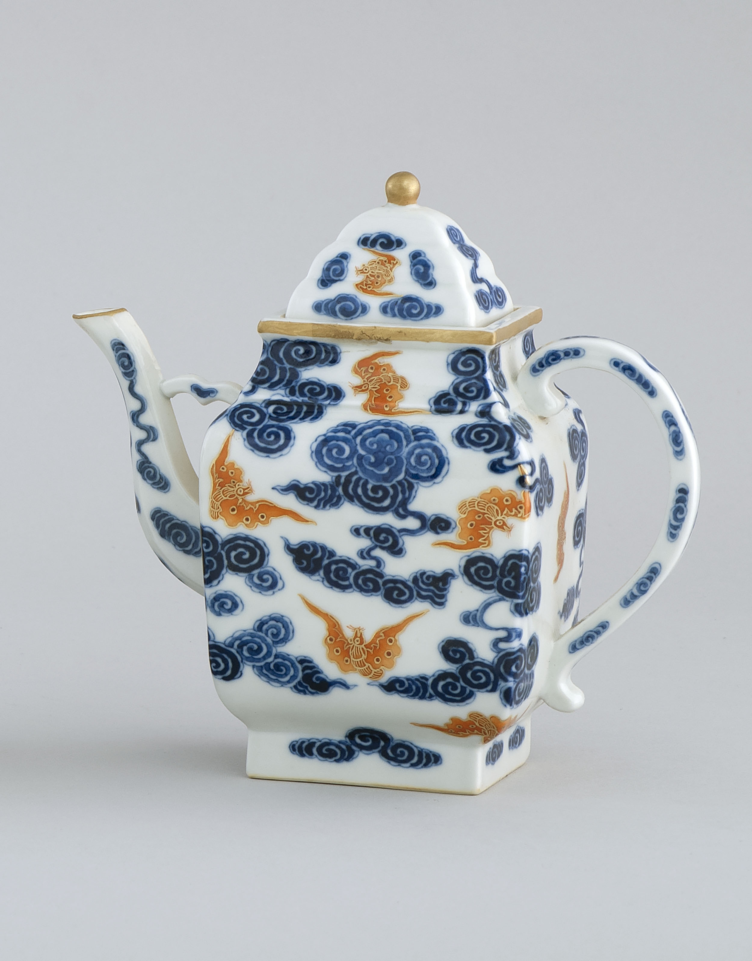 Appraisal: UNDERGLAZE BLUE AND RUST-RED PORCELAIN TEA POT th CenturyIn modified