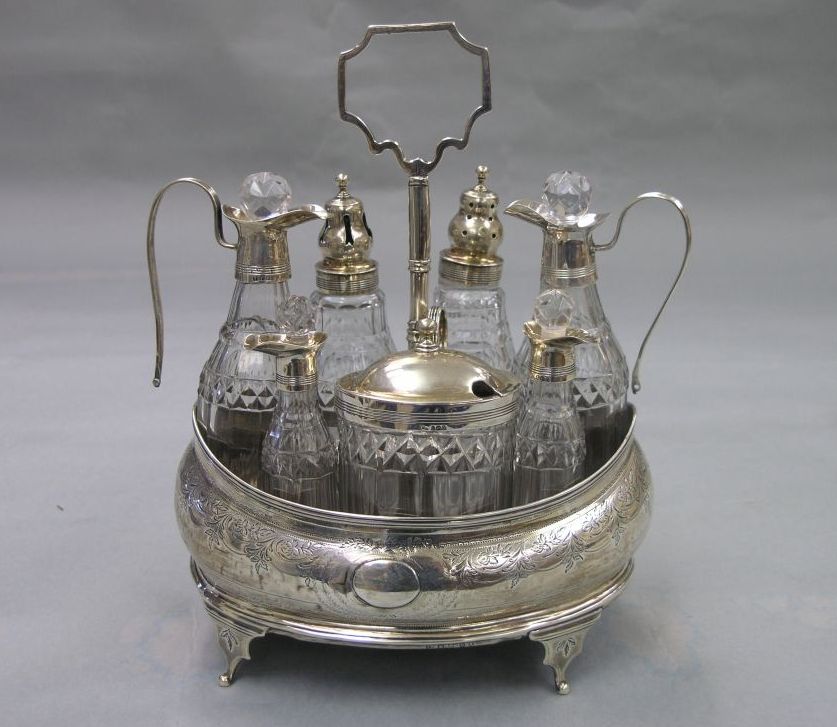 Appraisal: A George III silver cruet set London boat shaped cruet