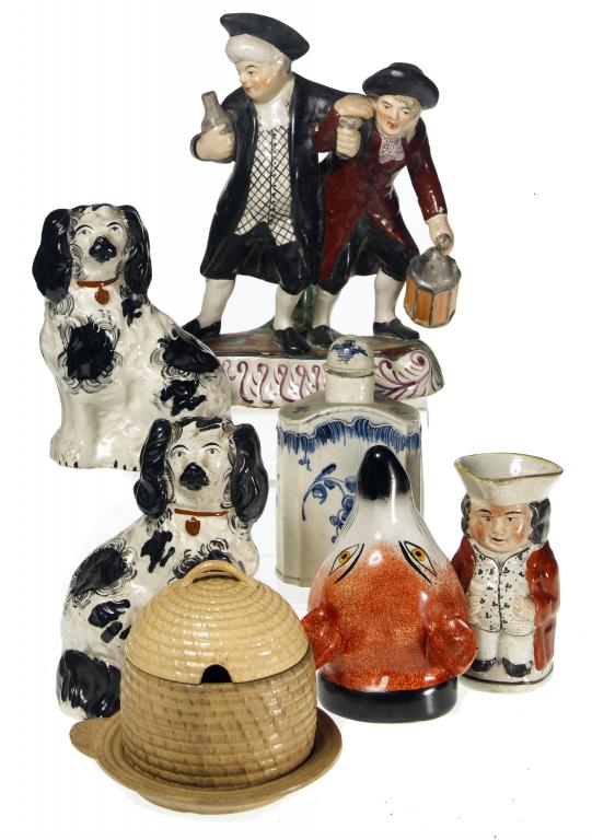 Appraisal: A PAIR OF STAFFORDSHIRE EARTHENWARE MODELS OF SPANIELS sponged in