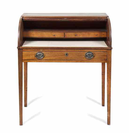 Appraisal: An American Roll-Top Writing Desk opening to a fitted interior