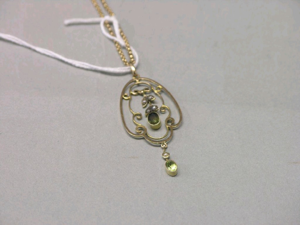 Appraisal: A late Victorian yellow metal peridot and seed pearl pendant