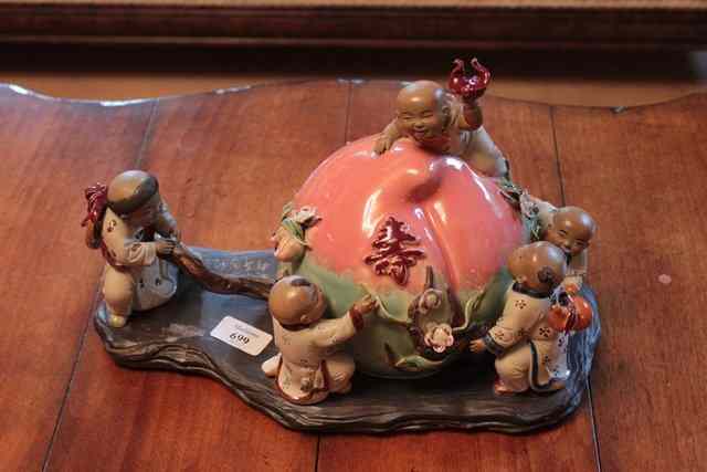 Appraisal: A CHINESE GLAZED STONEWARE SCULPTURE in the form of small