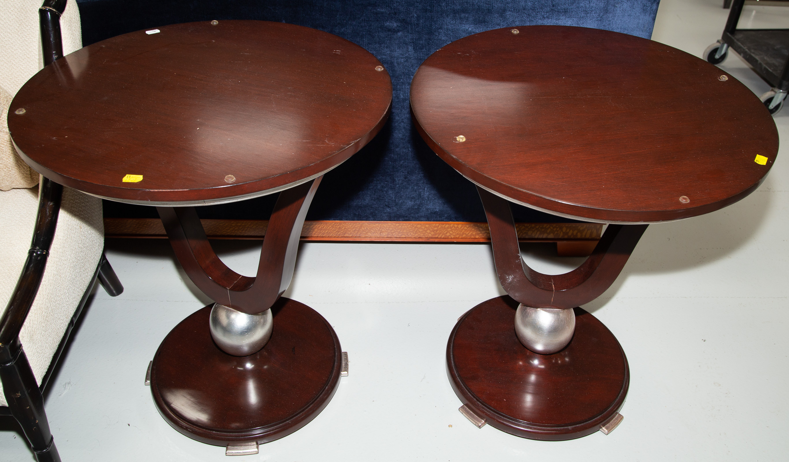 Appraisal: A PAIR OF ART DECO STYLE MAHOGANY LAMP TABLES Modern