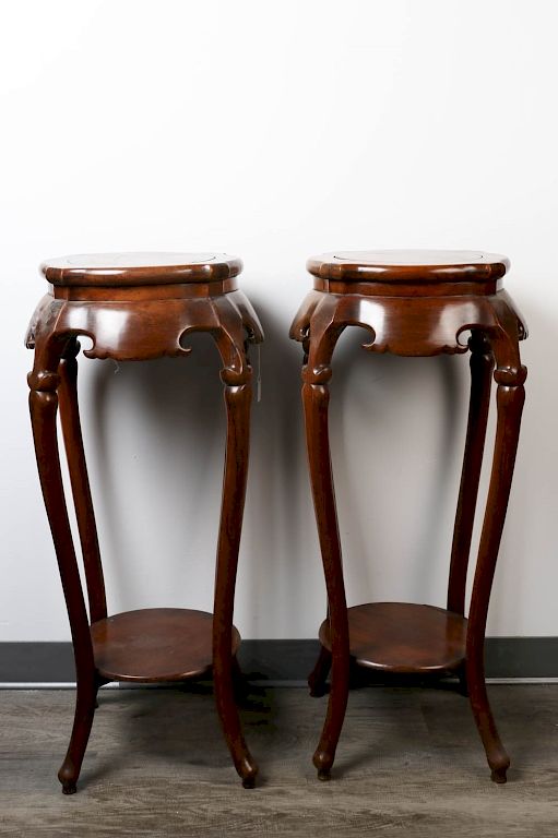 Appraisal: PAIR OF HUALI WOOD INCENSE STANDS Each with circular top