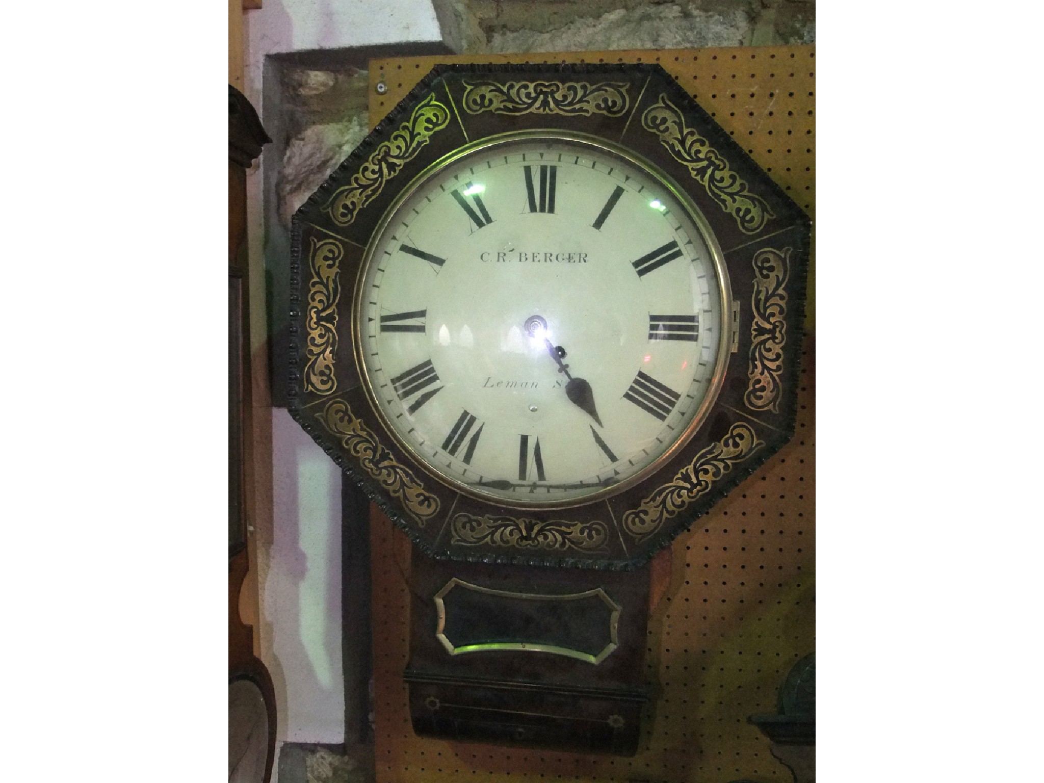 Appraisal: A Regency mahogany and brass inlaid drop dial wall clock