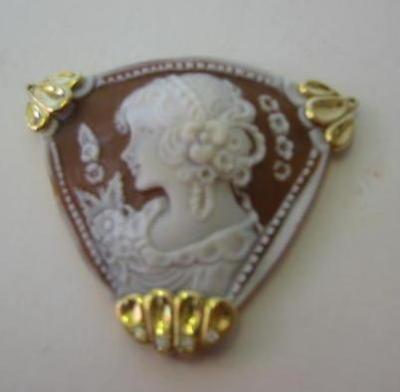 Appraisal: A CAMEO PENDANT of triangular form carved with a lady's