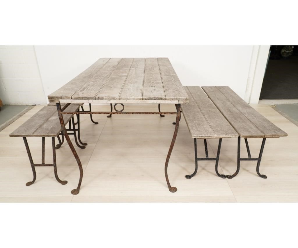 Appraisal: Wrought iron and weathered teak wood outdoor table with two