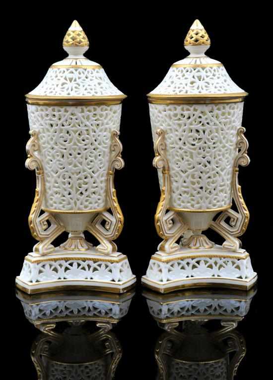 Appraisal: A pair of Grainger's Worcester reticulated porcelain lidded urns Circa